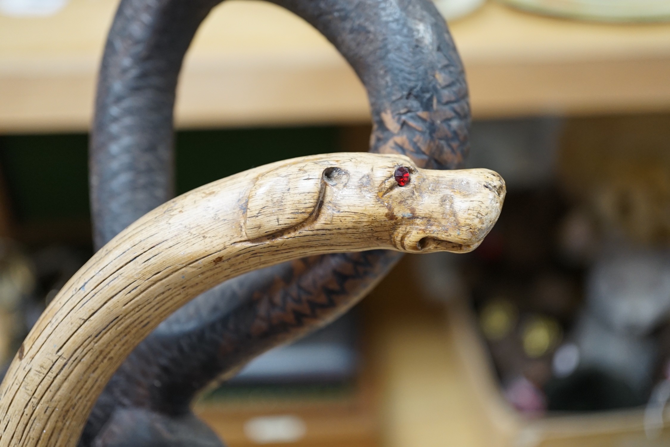 An African carved wood walking cane and a ‘dogs head’ walking cane